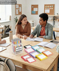 Back To School Must Have 16 Piece Composition Notebook Set With Sticky Notes And Ballpoint Pens on classroom desk