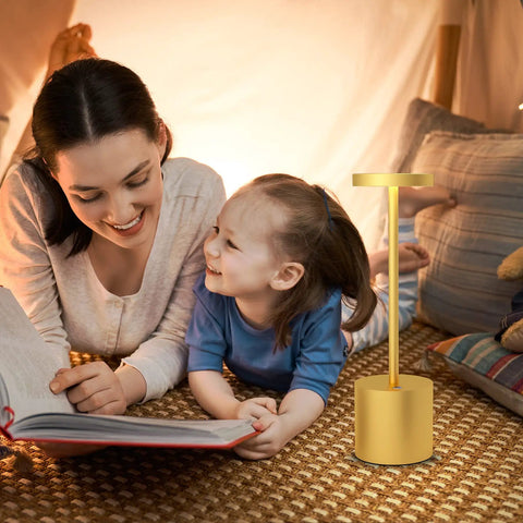 Mother and child reading with Two Pack Cordless Table Lamp Set with 5000mAh Rechargeable Battery, gold finish, on the table