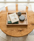 Top Shelf Water Based Polyurethane Acrylic Sealer on a wooden coffee table with books and decorative items.