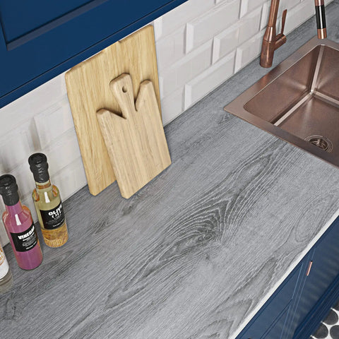 Gray Wood Grain Contact Paper 24x200 Self Adhesive Peel And Stick For Cabinets on kitchen countertop near sink.