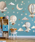 Dreamy Hot Air Balloon and Star Wall Decals Peel and Stick Vinyl Wall Stickers for Kiddo Sized Kids Room Nursery Decor on blue wall.