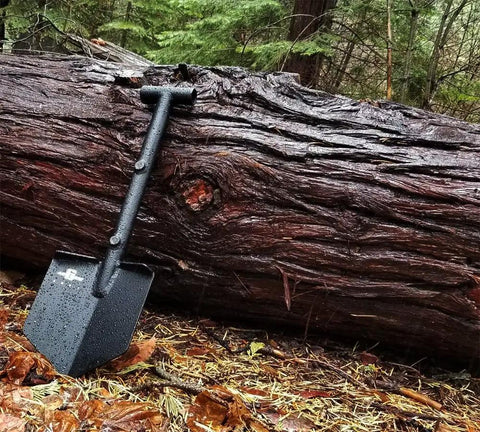 Adventure Mini Shovel 23 Inch Lightweight Aluminum Recovery Tool With Wrinkle Black Coating in outdoor forest setting