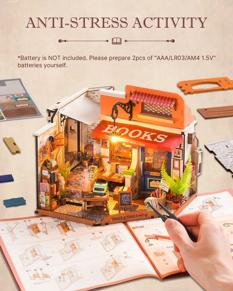 Person assembling DIY Miniature Bookstore Kit 1 To 20 Scale With LED Lights, showing detailed interior and instruction manual.