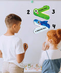 Children learning with Magnetic Greater Than Less Than Equal Signs Math Set For Classroom Demonstrations Easy Visual Aid.
