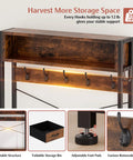 Close-up of Rustic Brown Hall Tree with hooks, storage bin, adjustable foot pads, and removable hooks.