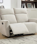 Chenille beige Two Seat Manual Loveseat Recliner Sofa with wall hugger design and independent reclining seats in living room.