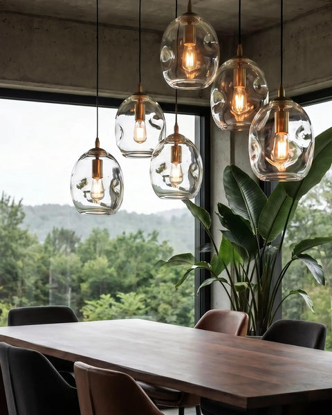 Dope Clear Art Glass Pendant Lights 2 Pack For Kitchen Island And Dining Room Table with sleek brass gold hardware over dining table.