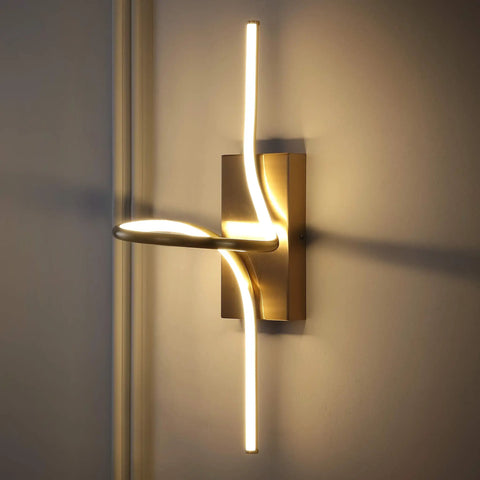 9-Inch Gold Modern Minimalist Integrated LED Vanity Light Sconce Dope Glow Dimmable Metal Wall Lamp illuminated against a wall
