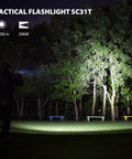 Rechargeable Pocket EDC Flashlight Tiny But Mighty 2000 Lumens LED Light illuminating trees in a park at night