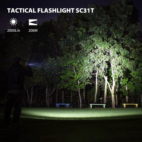 Rechargeable Pocket EDC Flashlight Tiny But Mighty 2000 Lumens LED Light illuminating trees in a park at night
