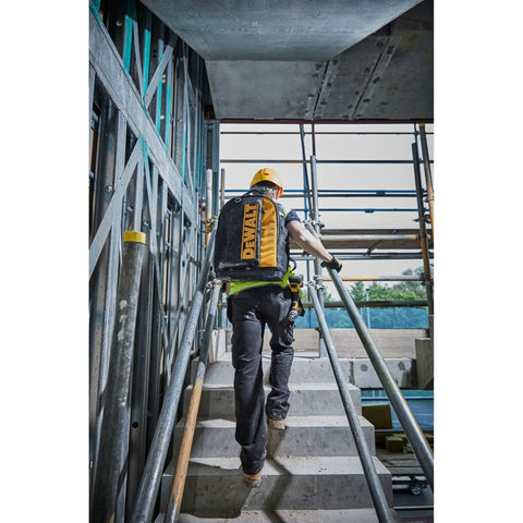Massive 40 Liter Tool Backpack Built Tough As Nails For Contractors being carried up stairs on a construction site.