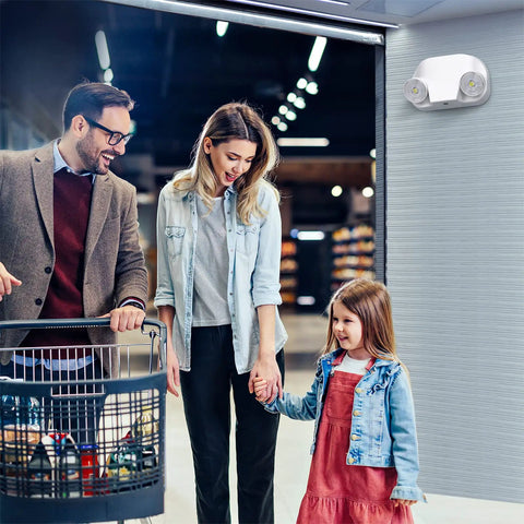 LED Emergency Light With Remote Capable And Adjustable Lamp Heads For Exit Lighting installed in a shopping area