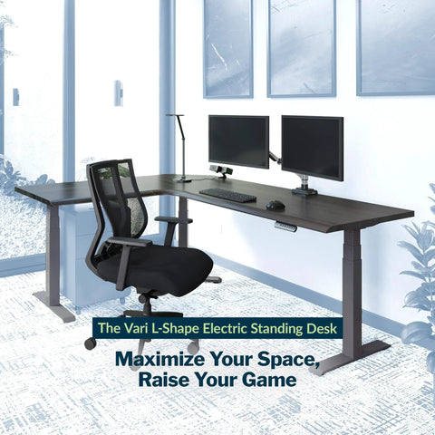 L Shape Electric Standing Desk With Height Adjustable Sit Stand Design For Corner Office Reversible Left Right Layout No Sweat Setup Espresso Top Slate Frame with dual monitors and ergonomic chair.