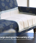 Adult Incontinence Bed Pads 36x36 Extra Large 50 Pack on a couch, quilted top for daily use as bed or furniture protection.