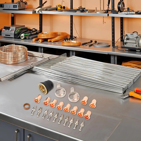 24 Piece Plasma Cutter Tip Electrode Nozzle Bracket Cover Set Made From Brass Zinc Alloy And Stainless Steel For CUT 55DS Pro And CUT 65DS Plasma Cutters IPT40 Tips Included Durable Consumables Kit laid out on a workshop table.