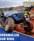 Off-road vehicle on rocky terrain, featuring Cruiser Accessories logo, custom license plate, and personalized styling messaging.