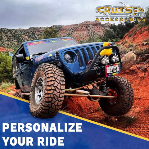Off-road vehicle on rocky terrain, featuring Cruiser Accessories logo, custom license plate, and personalized styling messaging.