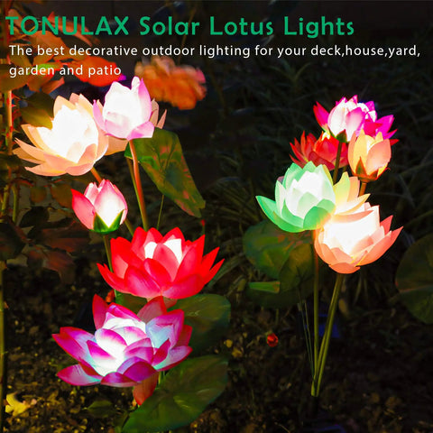 Solar Lotus Flower Lights 4 Pack illuminating garden with 7 color-changing LEDs, showcasing vibrant blooms at night.