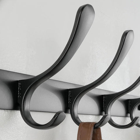 Close-up of Wall Mounted Coat Rack With Six Heavy Duty Hooks Stainless Steel Metal Hanger showing black finish and space for jackets.