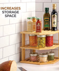 Total Kitchen Game Changer, Super Handy Bamboo Corner Shelf, 3 Tier Plate Rack, Easy Peasy Cabinet Organizer For Spices, Bowls, Mugs, And Snack Jars, Smart Space Saving Storage Solution displaying spices and sauces.