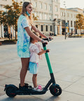 Parent and child riding electric scooter with Kiddo Height Adjustable Electric Scooter Handlebar Grip Bar For Safe Rides And Easy Hold Aluminum Alloy Armrest Handle Lightweight Durable Design Fits Xiaomi M365 Mijia Electric Scooters And Skateboards on open plaza