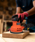 Pro Level Random Orbital Finisher Sander For Lightning Fast Wood And Metal Sanding With 230 Watt Motor being used on a wooden surface.