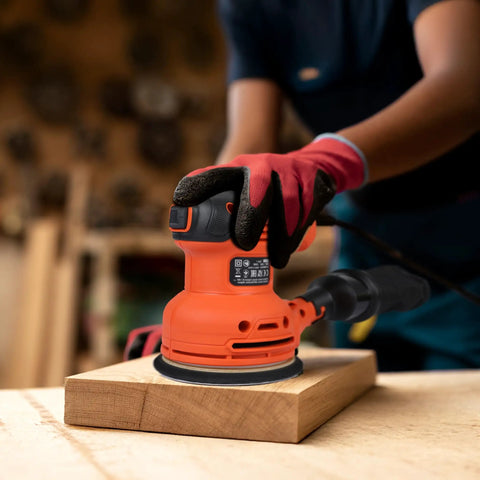 Pro Level Random Orbital Finisher Sander For Lightning Fast Wood And Metal Sanding With 230 Watt Motor being used on a wooden surface.