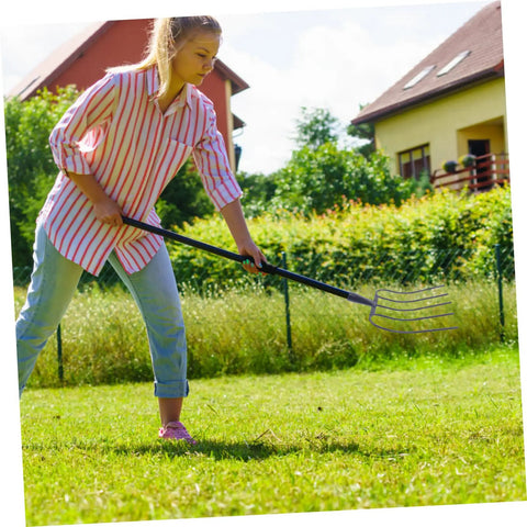 Person using Go To Yard Work Ready Agricultural Fork For Outdoor Farming And Lawn Care Maintenance With Versatile Prongs