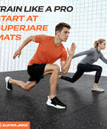 Two people running on Thick 0.56 Inch Interlocking Gym Flooring Mats With Rubber Top For Home Gym, black and gray surface visible.