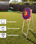 Backyard Archery Target Stand With Adjustable Heights And Ground Pegs, Sturdy Pine Wood, holding round target in lawn.