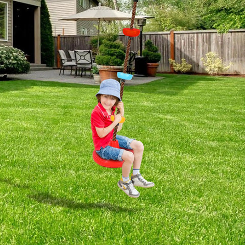 Child playing on rope ladder and disc swing set for kids, durable climbing ladder for swing sets, backyard fun, green lawn