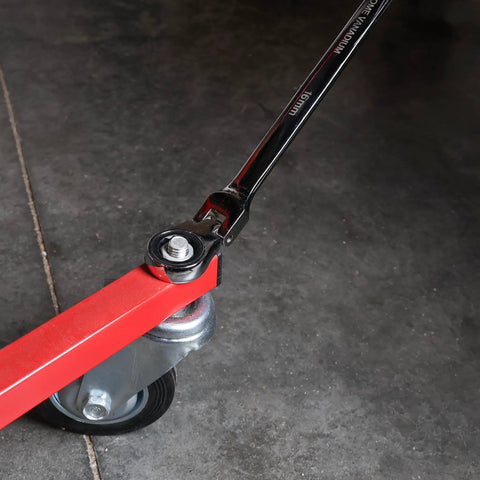 Double End Flexible Head Ratcheting Wrench 13mm And 15mm Set With 180 Degree Pivot in use on red metal tool base