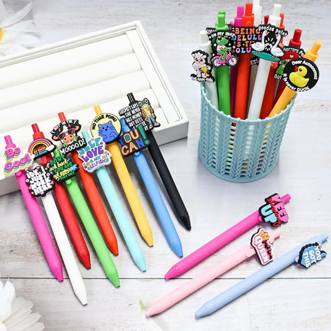 60 Piece Funny Pens Set For Adults with Positive Quotes and Quirky Graphics like cute animals displayed in pen holder