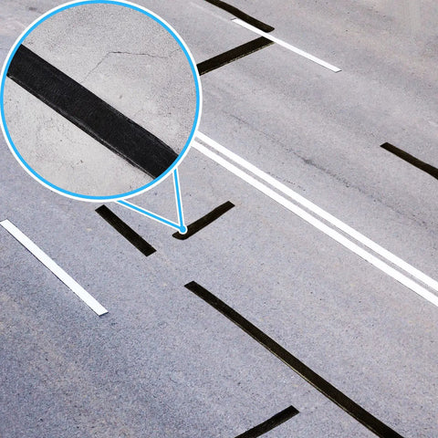 2 Inch Self Adhesive Asphalt Crack Filler Tape For Driveways And Parking Lots, 32.8 Feet Roll, 2.5 mm Thick installed on a road