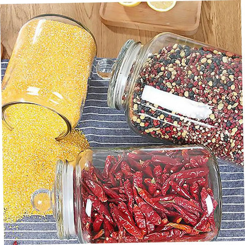 Level Up Your Pantry Setup With These Hella Tough 2 Liter Airtight Glass Tea Canisters And Food Storage Jar Set with spices and grains.
