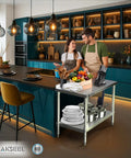 Two people in a kitchen with Pro Grade Heavy Duty Stainless Steel Prep Table 24 By 36 Inches With Undershelf And Backsplash NSF Certified.