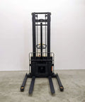 Built Tough Electric Wide Leg Pallet Stacker Heavy Lifter With 2204 Lbs Capacity And 130 Inch Lift Featuring Maintenance Free Battery 110V Us Plug Speed Control And Three Year Warranty Yellow front view on concrete floor.