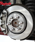 Raybestos R-Line front disc brake rotor on a six-lug hub with silver caliper.