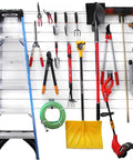 Garage setup with One Eighth Inch Steel Backplates Hook Kit For PVC Slatwall Panels; tools and ladder organized on slatwall.