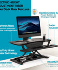 PowerPro 36 Inch Electric Standing Desk Converter with monitor, black ergonomic riser, wide keyboard tray and USB port