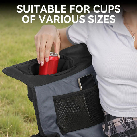 Person using cup holder and side pocket on oversized double camping chair with padded seats and foldable loveseat for adults.
