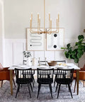 Dining room with gold rustic industrial 8 Lights Farmhouse Chandelier Gold Rustic Industrial Candle Ceiling Light Fixture For Living Room Dining Room Kitchen Island Foyer And Bedroom Cozy Vibe
