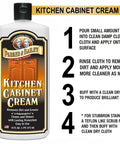 Bottle of Kitchen Cabinet Creme Cleaner And Grease Remover For Wood Surfaces, No Fuss 16 Oz with cleaning instructions visible