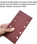 Hand holding a hook and loop sandpaper sheet with perforations, displaying texture and design, for 1/3 sheet sander pack with 60 80 100 120 150 and 240 grit aluminum oxide for woodworking metalworking and paint projects a versatile grit set for smoothing rough surfaces removing finish and tackling DIY renovations.