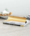 Box of Gold Embossed Pop-Up Foil Sheets 10.8 X 9 Inch Interfolded Greaseproof for fast-service kitchens, with tacos wrapped in foil