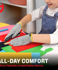 Kid using Kids Cutting Gloves XS 8-12 Years - Food Grade Safety, Level 5 Cut Protection during crafting with colorful paper.