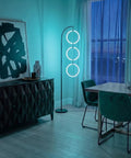 Dope RGB Color Changing Floor Lamp With Arching Three-Ring Pendant in a modern living room, dimmable LED, black sleek finish