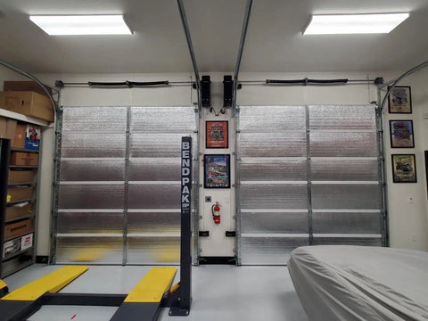 Heavy Duty 24 By 50 Ft Reflective Insulation Roll With R17 Foam Core Radiant Barrier installed in garage for effective heat blocking.