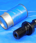 Badass Cat50 Coolant Through Mas Retention Knob Pairs With Beefy Pull Stud and Smooth 45 Degree Taper One Inch Eight Thread close-up on blue background.