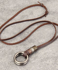 Top Shelf Handcrafted Leather Necklace For Men And Women Boasting A Fly Vintage Hippie Design With Adjustable Long Cord And Smooth Durable Alloy Cross Pendant In Classic Brown, featuring a brown leather strap and alloy ring.